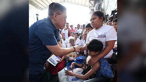 SENATOR Bong Go consoles Tondo fire victims.
