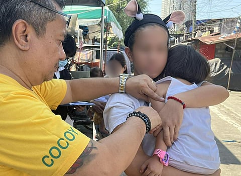 The Quezon City Epidemiology and Surveillance Division conducting an Outbreak Response immunization in Barangay Bahay Toro in Quezon City last 11 March.