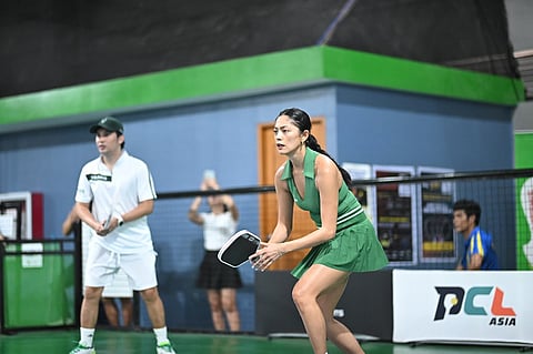 ARIELLA Arida prepares for a forehand return as teammate Christian Andres looks on during their mixed doubles gold medal match in Kosmas Pickle Fest 2026 in Cebu City.   