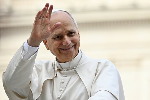 Pope Leo XIV waves to the crowd during the weekly general audience at St Peter's Square in The Vatican on 11 March 2026.