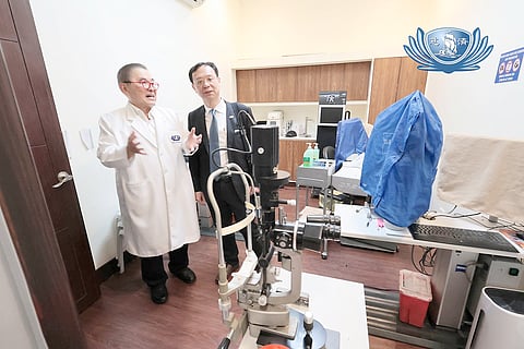 TAIWAN Health and Welfare Minister Chung-Liang Shih ( right) is briefed by Tzu Chi Medical Foundation Philippines president Dr. Antonio Say on the latest technology used at the Tzu Chi Eye Center. 