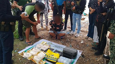 MEMBERS of the Philippine Coast Guard present the seized suspected shabu weighing seven kilograms and worth at least P47.6 million following a joint maritime operation in the vicinity waters off Barangay Sibutu, Tawi-Tawi.