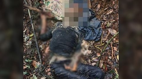 SOLDIERS from the Philippine Army discover the body of an abandoned rebel leader during a pursuit of the Sub-Regional Committee Sesame in Hinabangan, Samar. The discovery was officially reported by the military on Monday.