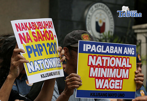 (March 16 2026) Militant group Kilusang Mayo Uno trooped to the House of Representatives in Quezon City on Monday, March 16, 2026, to protest in time with the House Committee on Labor hearing tackling legislation on the re-establishment of a National Minimum Wage to call for the abolition of Regional Wage Boards and establishment of PHP1200 nationwide minimum wage. Photo/Analy Labor