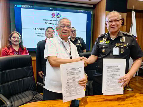 Subic Bay Metropolitan Authority (SBMA) Chairman and Administrator Eduardo Jose L. Aliño and Bureau of Jail Management and Penology-Regional Office 3 (BJMPRO3) Director, Jail Chief Superintendent (JCSupt) Paulino H. Moreno Jr. show the memorandum of agreement (MOA) they signed for the Adopt-a-Mangrove Program on March 12, 2026 at the SBMA corporate boardroom. 
