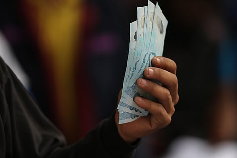 Tricycle drivers receive ₱5,000 in cash assistance during a DSWD payout at the Dakota Covered Court in Ermita, Manila, on 16 March 2026. The site is one of 30 locations identified by the Department of Social Welfare and Development across the National Capital Region to facilitate the distribution.