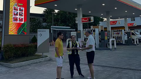 Anthony Pangilinan shares a moment at their fuel station as he outlines the price cuts he and his son are set to roll out.