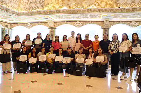 Teacher participants receive their Certificates of Completion from DepEd-Bataan Superintendent Carolina Violeta, EdD CESO V (3rd from right), and GMEC-GNPD Reputation and Stakeholder Management Manager Joseph Paolo Mendoza (4th from right). 