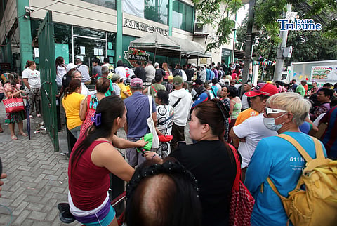 (March 18 2026) Consumers wait in a long queue as they try to purchase the P20 per kilo rice at the Kadiwa Store along elliptical road in Quezon City on Wednesday, March 18, 2026. A customer said they waited in line for a long time because the price of commercial rice at the market was too high. Photo/Analy Labor