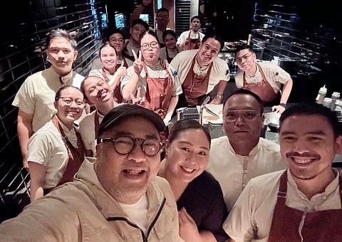 ANDREI Xavier Lorenz B. Factora (middle row, 2nd from right) with the owners and coworkers at Hapag.