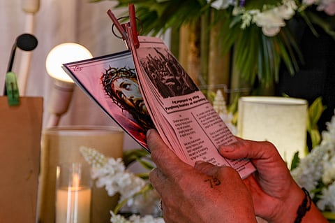 Men are seen performing the “Pabasa” in a small altar in Brgy. San Roque, Navotas on Saturday, 21 March, 2026.| Aram Lascano 