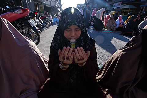 Filipino Muslims gather at Baseco, Manila, on 21 March 2026, to celebrate Eid'l Fitr. The festivities mark the conclusion of Ramadan, bringing the community together for prayer and reflection.