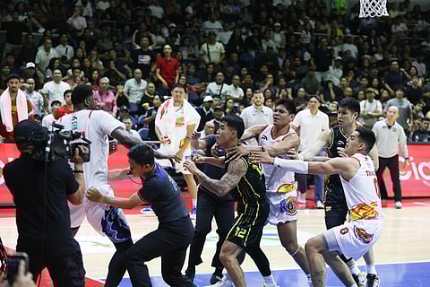 TNT Tropang 5G’s Glenn Khobuntin and Rain or Shine import Jaylen Johnson reenact the epic 1975 slugfest between Muhammad Ali and Joe Frazier during a heated game in the PBA Commissioner’s Cup Friday night at the Araneta Coliseum.