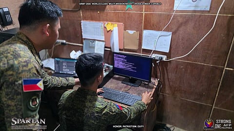 TROOPS try the computers donated by Solaire Cares.