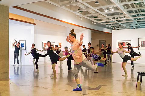 YOUNG dancers rehearse a contemporary piece under the guidance of their instructor.