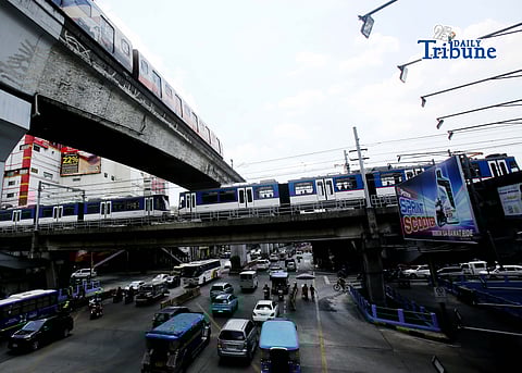 Trains of the Metro Rail Transit Line 3 and Light Rail Transit Line 2 run along tracks in Cubao, Quezon City, 23 March 2026, as a 50 percent fare discount takes effect to help ease the impact of rising fuel prices. The discount applies to all passengers, except those already entitled to reduced fares such as students, senior citizens, and persons with disabilities.  
