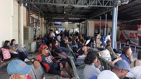 PASSENGERS of a bus terminal in Cubao, Quezon City this Tuesday, March 24.