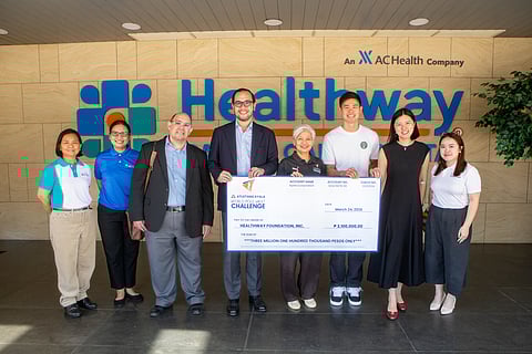 EJ Obiena hands the P3.1 million Atletang Ayala donation to officials of Healthway Foundation led by its chairman, Paolo Borromeo