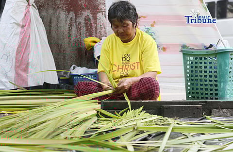 (March 26 2026) A vendor makes creative “palaspas” outside the Santo Domingo Church in Quezon City on Thursday, March 26, 2026, in preparation for Palm Sunday. Photo/Analy Labor
