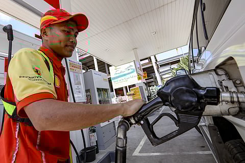 FUEL on edge A man fills a vehicle’s tank in Pasay City as petroleum firms raise alarm over tightening fuel supply in the country.