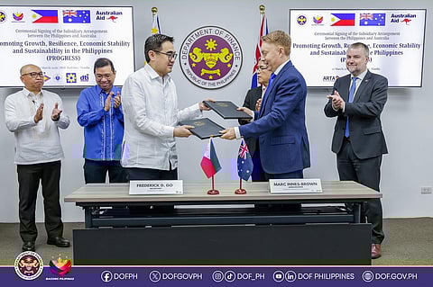 FINANCE Secretary Frederick D. Go and Australian Ambassador Marc Innes-Brown shake hands on the subsidiary arrangement formalizing Australia’s AUD 45 million (P1.8 billion) grant in support of the Promoting Growth, Resilience, Economic Stability and Sustainability Program, Australia’s flagship initiative designed to help the Philippines achieve more inclusive and sustainable economic growth.