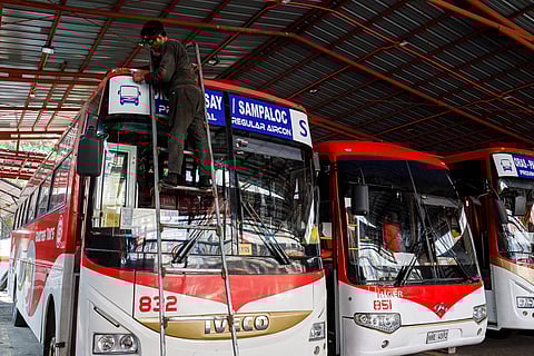
Workers conduct maintenance on buses at a terminal in Manila on Saturday, 28 March  2026, ahead of the expected Holy Week exodus.


