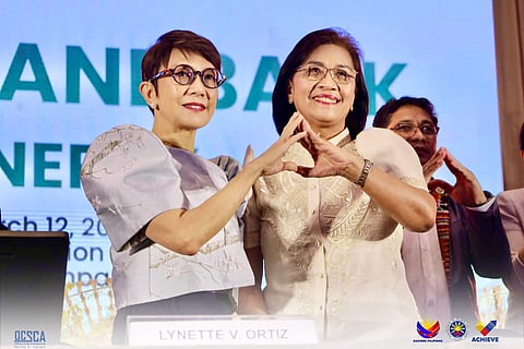 CHED chairperson Shirley Agrupis (right) and LandBank president and chief executive officer Ma. Lynette Ortiz seal partnership on modernizing agriculture education. 