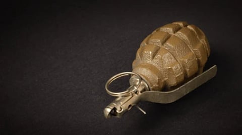 Grenade attack hurts child, damages taxi