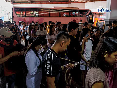 Passengers queue at a bus terminal in Sampaloc, Manila on Sunday, 29 March 2026, as they travel early to their respective provinces ahead of the Holy Week exodus.JohnCarloMagallon
