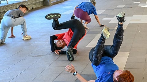 ELDERS warm up before a parkour training session in Singapore.