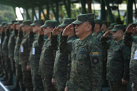 PHILIPPINE Army Commanding General Lt. Gen. Antonio G. Nafarrete renders a snappy salute to the Philippine Flag during the Recognition for participating personnel in the 129th Philippine Army Founding Anniversary Ceremonies at the Philippine Army headquarters in Fort Bonifacio.