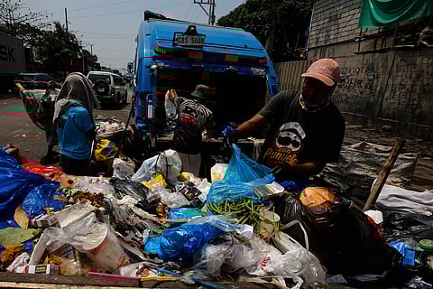 Workers sort waste materials—primarily kitchen scraps—along Road 10 in Tondo, Manila, on the International Day of Zero Waste, 30 March 2026. According to the United Nations Environment Programme's 2024 Food Waste Index Report, the world wastes approximately 1 billion tons of edible food annually, severely impacting both global food security and the environment.