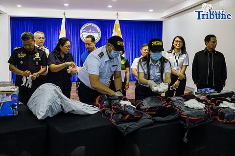 Customs officials, assisted by a K-9 unit, rip open inbound parcels containing suspected illegal drugs during a press conference at Ninoy Aquino International Airport in Pasay City on Tuesday, 31 March 2026.

The agency said the seized methamphetamine hydrochloride, or shabu, is valued at about P38 million, adding that anti-drug operations have led to the confiscation of P1.865 billion worth of illegal drugs since the start of the year.