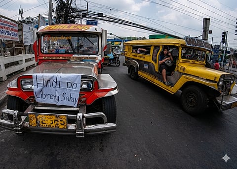 GEORGE Cahanding makes sure commuters do not mistake his jeepney for one of the public utility vehicles the government has paid to provide free rides amid the fuel crunch.