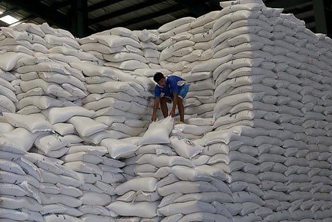 A WORKER at the National Food Authority tend to sacks of rice inside an NFA warehouse, part of ongoing efforts to secure supply for the majority of the population.
