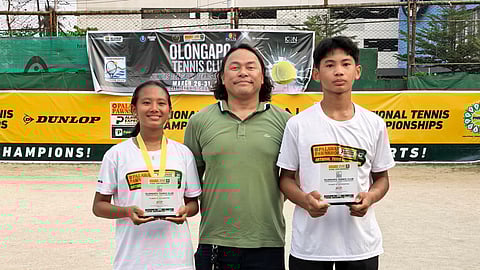 MIGUEL Lagac III (right) lifts the trophy after sweeping two singles titles in the Olongapo national juniors, alongside co-Most Valuable Player awardee Jan Cadee Dagoon (left) and Olongapo Tennis Club director Dr. Marion Ridon.