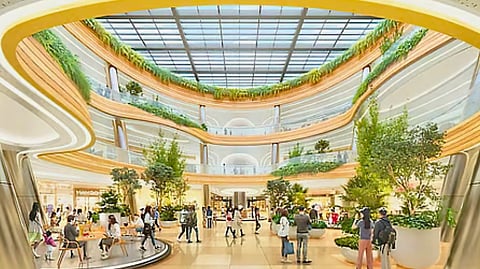 STEVEN T. Tan, president of SM Supermalls said the planned SM Harrison Plaza "will incorporate nature-inspired architectural elements alongside open layouts, community spaces and green areas designed to support cultural and social activities." Photo shows the spacious atrium, designed to be the centerpiece of SM Harrison Plaza set to open in 2027.
