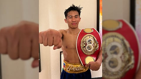 PEDRO Taduran proudly shows the IBF minimumweight belt that he retained following his seventh-round stoppage of Gustavo Perez Alvarez on Saturday (Manila time) at the Pechanga Resort and Casino in Temecula, California.    
