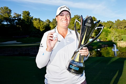 LAUREN Coughlin lifts the trophy after completing a wire-to-wire victory in the Aramco Championship at the Shadow Creek course in Las Vegas.    