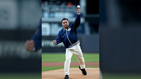 MANNY Pacquiao throws the ceremonial first pitch before the game between the New York Yankees and the Athletics at Yankee Stadium in the Bronx in New York City on Wednesday (Manila time).