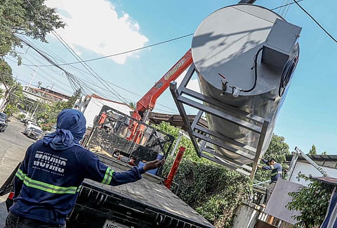 
An oil tank containing 12,000 liters of diesel intended for fuel transfer is lifted in Barangay Sacred Heart, QuezonCity on 8 April 2026, as a businessman and a homeowner face possible economic sabotage charges over the alleged hoarding of fuel amid the ongoing crisis. | Aram Lascano
