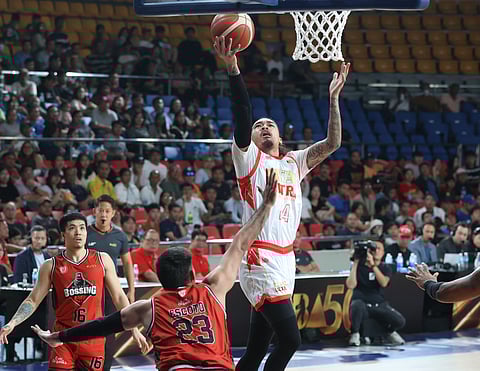 JOSHUA Munzon soars his way to a 25-point performance to lead Titan Ultra to a 102-98 win over Blackwater in the PBA Commissioner’s Cup on Wednesday at the Ninoy Aquino Stadium.