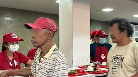 JEEPNEY drivers are treated with a free meal at the Department of Social Welfare and Development Kitchen inside the Nasdake Building in Pasay City on Friday.