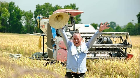 Danilo Bolos, who heads the Crisol Bagong Pag-asa Irrigators Association, celebrates a bountiful rice harvest using less urea-based fertilizer. His method yielded 10 metric tons per hectare at a production cost of P10 a kilo. 