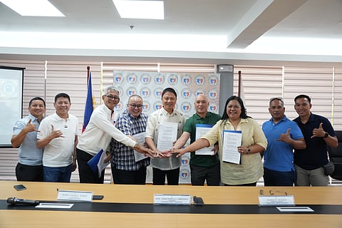 PSC chairperson Patrick Gregorio (center) formally signs the partnership with Surigao del Norte officials for the renovation of Cloud 9 Towers in time for the staging of the World Surf League QS6000 in October. Joining Gregorio are officials from the town of General Luna alongside PSC Commissioner Matthew Gaston.