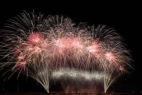 Philippines' Platinum Fireworks Incorporated lights up the Manila Bay skies during the finale exhibition of the 13th Philippine International Pyromusical Competition at the SM Mall of Asia in Pasay City on 11 April 2026. Pyrotex Fireworx from the United Kingdom took this year's championship title, besting seven other competing countries.