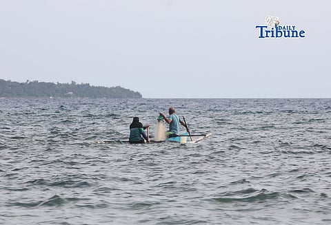 (April 11 2026) Fishermen riding a boat carrying fishnet, looking for a fish to catch at Sandingan island, Brgy. Basdio, Loon Bohol on Saturday April 11, 2026. Photo/Analy Labor
