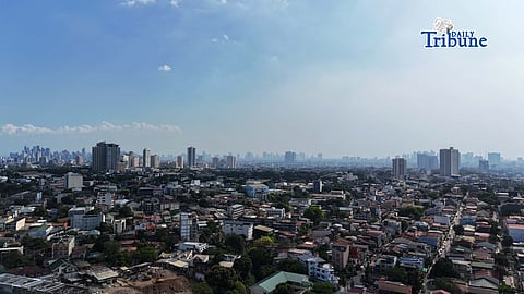 (April 13 2026) On Monday a haze still seen in Quezon City and neighboring cities , due to the contained fire razing the closed Navotas City Sanitary Landfill as the Environmental Management Bureau-National Capital Region (EMB-NCR) warns the public to be cautious and mask up against harmful air pollutants from the fire. Photo/Analy Labor
