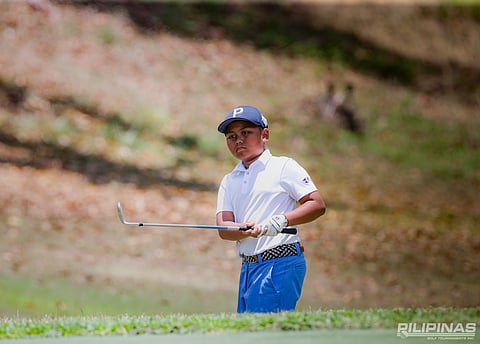 LUCAS Revilleza fires a 74 to gain control of the 7-10 division of the ICTSI Alta Vista Junior PGT Championship at Alta Vista Golf and Country Club on Monday.