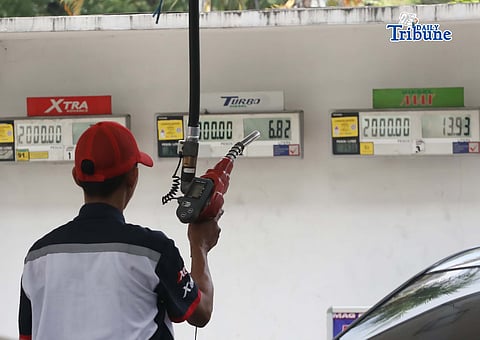 Motorists are assisted by gasoline station attendants along Kalayaan Avenue on Monday.

Fuel prices are set to roll back on Tuesday, with diesel expected to drop by P20.89 to P23 per liter, gasoline by P4.43 per liter and kerosene by P8.50 per liter, offering relief after weeks of increases driven by the Middle East conflict.